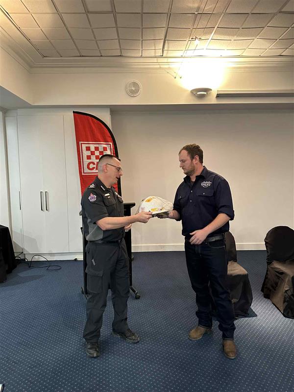 New Mt Delegate Group Officer Jon Marshall receiving his helmet from Commander Aaron Worcester